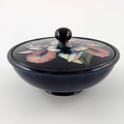 649 - William Moorcroft, an Orchid bowl and cover, circa 1935, squat form with flat cover, spherical knop,... 