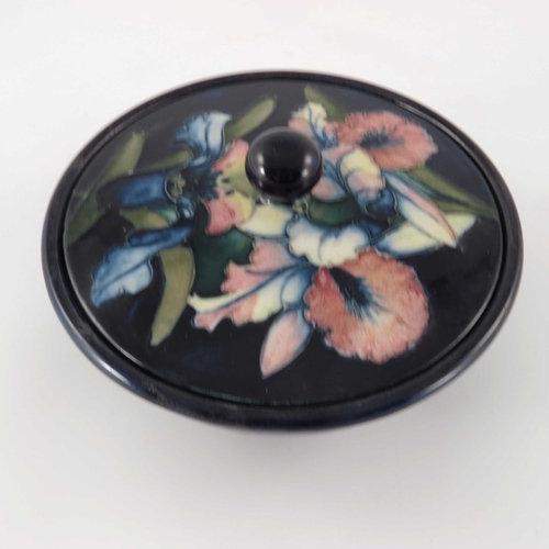 649 - William Moorcroft, an Orchid bowl and cover, circa 1935, squat form with flat cover, spherical knop,... 