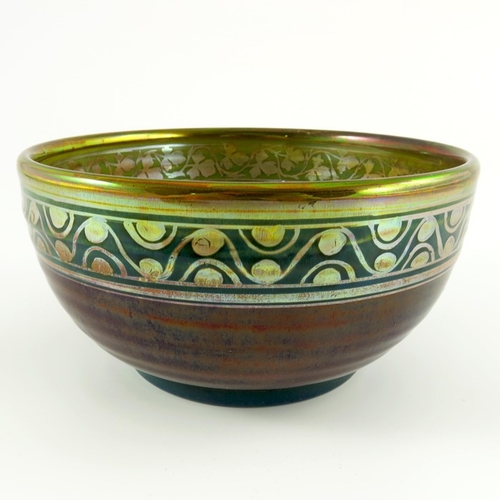 656 - Charles Cundall for Pilkington, a Royal Lancastrian lustre bowl, 1909, the exterior with a sang de b... 