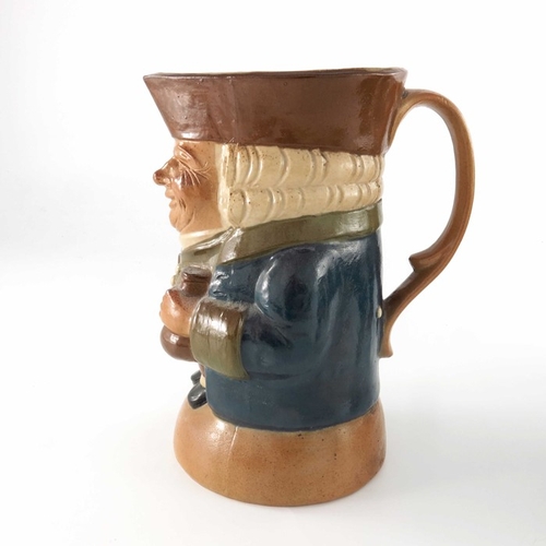 668 - Harry Simeon for Doulton Lambeth, a graduated set of three Toby jugs, each modelled with bottle and ... 