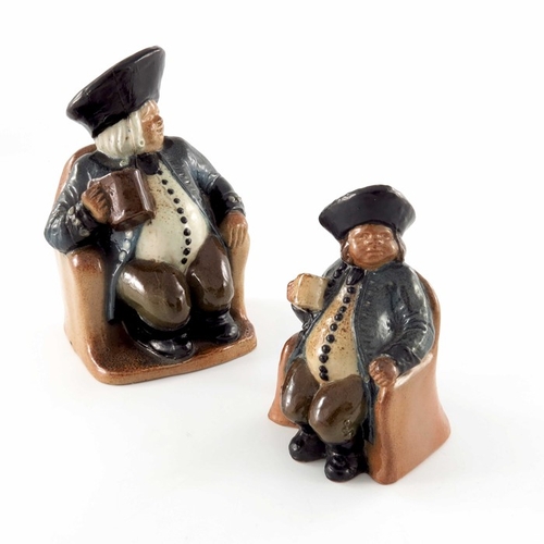 675 - Harry Simeon for Doulton Lambeth, a graduated pair of stoneware ash pots, modelled as seated Toby in... 