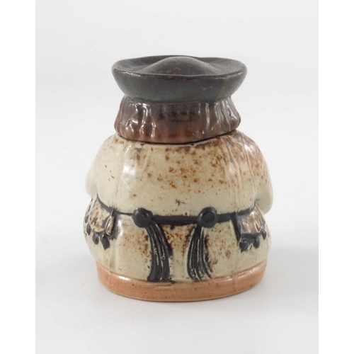 677 - Harry Simeon for Doulton Lambeth, a stoneware inkwell modelled as a Toby, the lid in the form of his... 