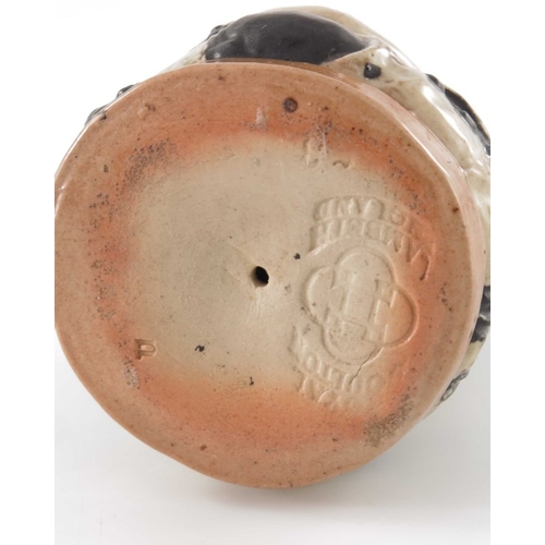 677 - Harry Simeon for Doulton Lambeth, a stoneware inkwell modelled as a Toby, the lid in the form of his... 