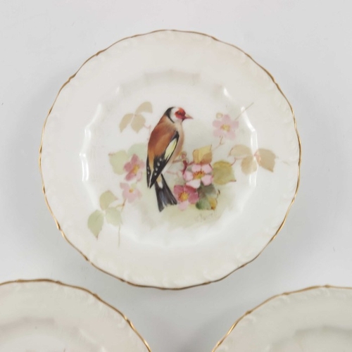 718 - W Powell for Royal Worcester, three small bird painted plates, 1917, decorated and titled Gold Finch... 