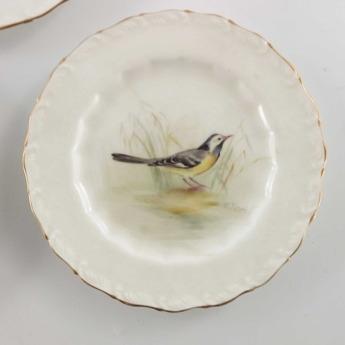 718 - W Powell for Royal Worcester, three small bird painted plates, 1917, decorated and titled Gold Finch... 