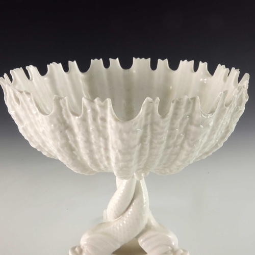 724 - A Royal Worcester blanc de Chine pedestal comport, the relief moulded urchin shell bowl with denticu... 