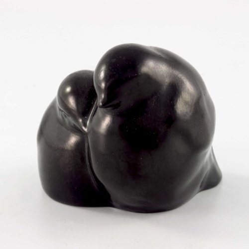 744 - Charles Noke for Royal Doulton, a figure group Two Chicks, black glazed, printed mark, 6.5cm high