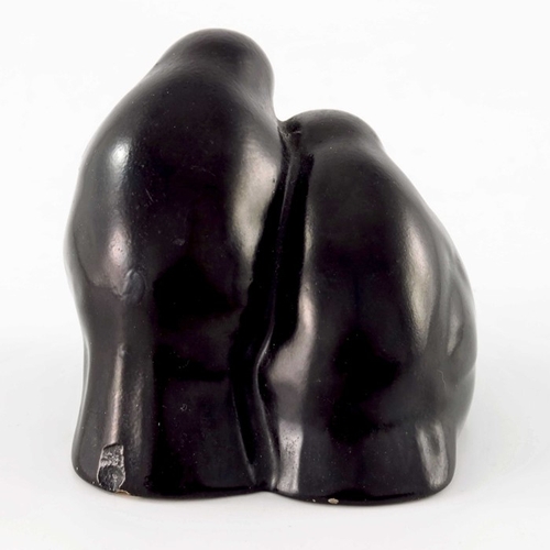 744 - Charles Noke for Royal Doulton, a figure group Two Chicks, black glazed, printed mark, 6.5cm high