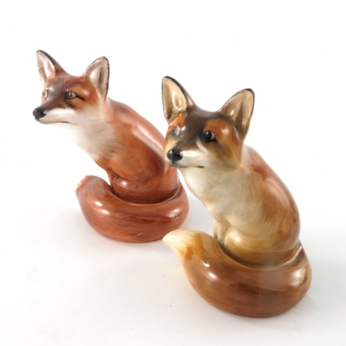 753 - Charles Noke for Royal Doulton, three fox figures, HN147 and HN130, two modelled sitting, in differe... 