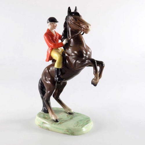 760 - A Beswick figure Huntsman on Rearing Horse, first version, with orange jacket and yellow trousers, 2... 