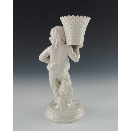 764 - A Belleek first period bisque and glazed porcelain figural spill vase, modelled as a boy holding a b... 