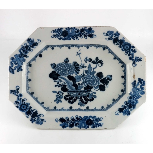 767 - An 18th century Dublin Delft blue and white charger, circa 1770, octagonal form, painted with a cent... 