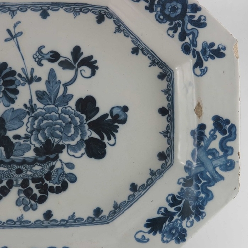 767 - An 18th century Dublin Delft blue and white charger, circa 1770, octagonal form, painted with a cent... 