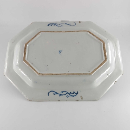 767 - An 18th century Dublin Delft blue and white charger, circa 1770, octagonal form, painted with a cent... 