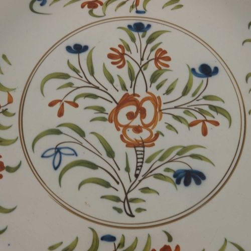 781 - A large pearlware dish, circa 1800, painted in Prattware colours with floral sprigs, moulded and blu... 