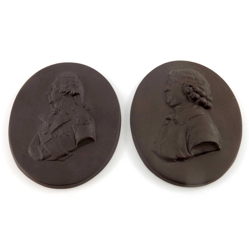 793 - Two Wedgwood style portrait plaques, Nelson and Josiah Wedgwood, modelled in relief in brown basalt,... 