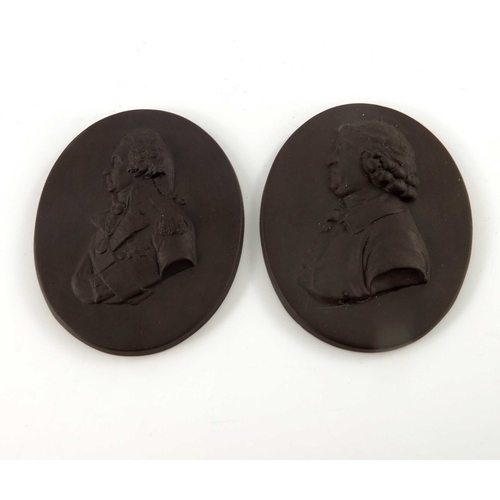 793 - Two Wedgwood style portrait plaques, Nelson and Josiah Wedgwood, modelled in relief in brown basalt,... 