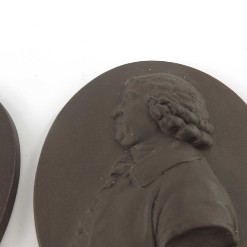 793 - Two Wedgwood style portrait plaques, Nelson and Josiah Wedgwood, modelled in relief in brown basalt,... 