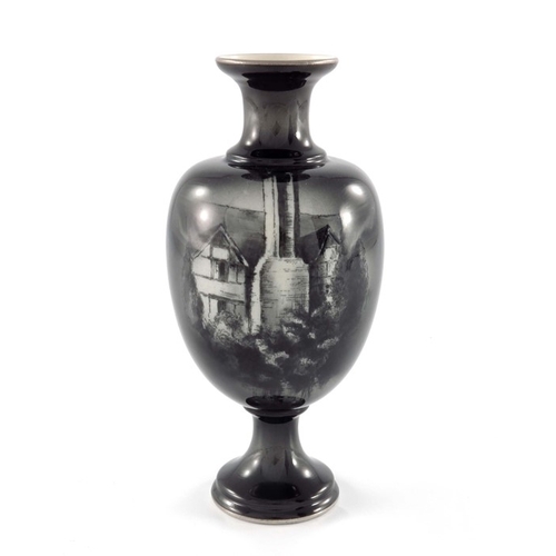 722 - A Royal Worcester black and white vase, baluster footed form, circa 1905,  decorated with a timbered... 