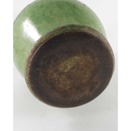 771 - A 19th century green glazed earthenware jug, possibly Farnham, ovoid form, incised to the shoulder w... 