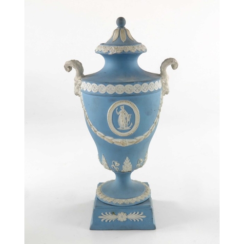 775 - Two Wedgwood Jasperware urn vases and covers, late 19th century, twin handled, one white on blue, og... 