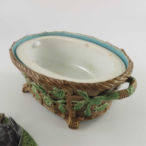 796 - A Minton majolica game pie dish and cover, circa 1875, the lid modelled as game resting on ferns and... 