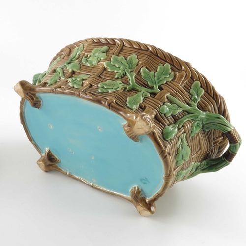 796 - A Minton majolica game pie dish and cover, circa 1875, the lid modelled as game resting on ferns and... 