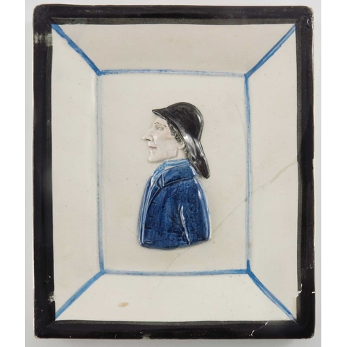 800 - A pearlware relief moulded portrait plaque of a sailor, modelled in profile, within integral frame, ... 