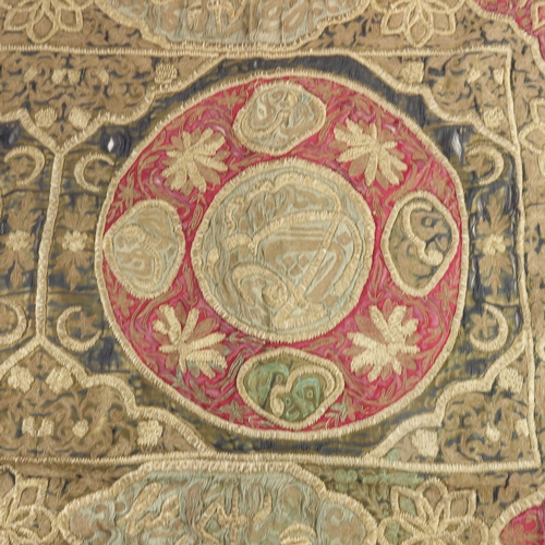 439 - An Islamic Ottoman embroidered satin tomb cover, 19th century, inscribed roundels surrounded by a ca... 