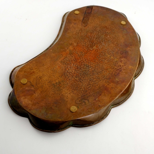 520 - J F Pool, Hayle, an Arts and Crafts copper tray, kidney form, embossed planished ground within an Ar... 