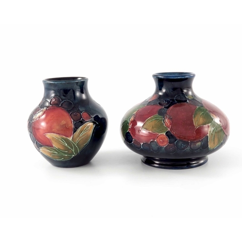 635 - William Moorcroft, two small Pomegranate vases, circa 1935, shouldered and baluster forms, impressed... 