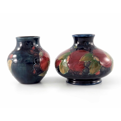 635 - William Moorcroft, two small Pomegranate vases, circa 1935, shouldered and baluster forms, impressed... 