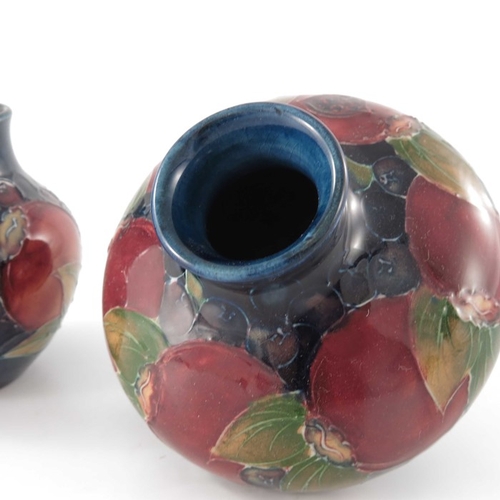 635 - William Moorcroft, two small Pomegranate vases, circa 1935, shouldered and baluster forms, impressed... 