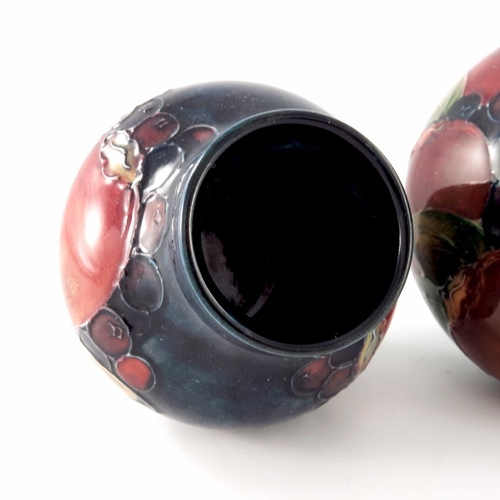 635 - William Moorcroft, two small Pomegranate vases, circa 1935, shouldered and baluster forms, impressed... 