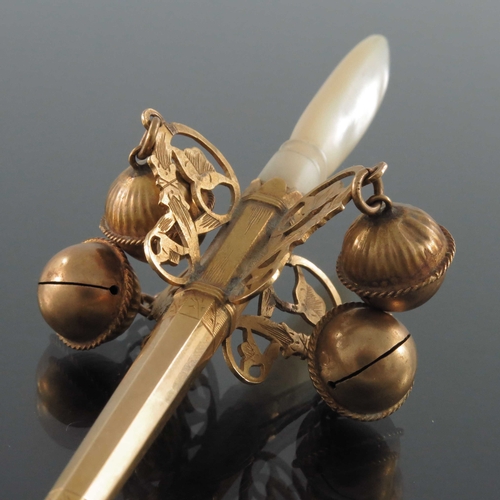 198 - An 18th century high carat gold baby's teether rattle, circa 1730, with tapered octagonal section wh... 