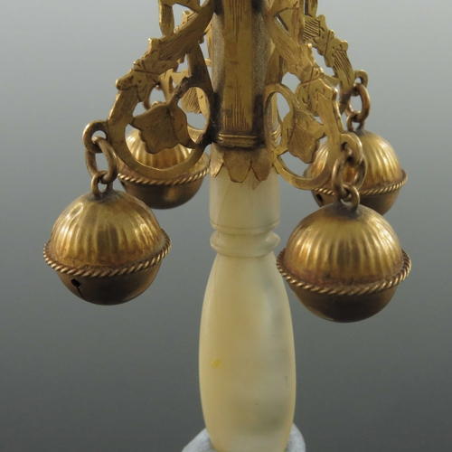 198 - An 18th century high carat gold baby's teether rattle, circa 1730, with tapered octagonal section wh... 