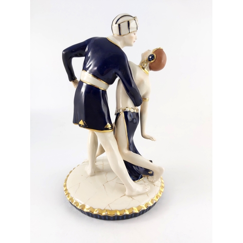 604 - Royal Dux, an Art Deco figure group, modelled as two dancers in Arabic dress, impressed marks and pi... 