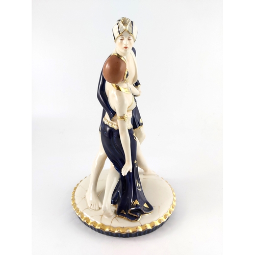 604 - Royal Dux, an Art Deco figure group, modelled as two dancers in Arabic dress, impressed marks and pi... 