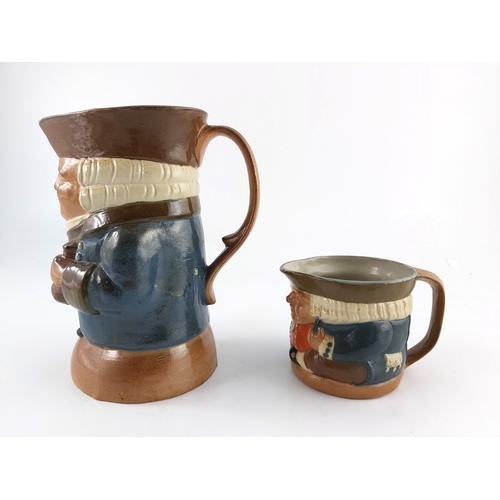 662 - Harry Simeon for Doulton Lambeth, two stoneware Toby jugs, one modelled with bottle and wine glass, ... 