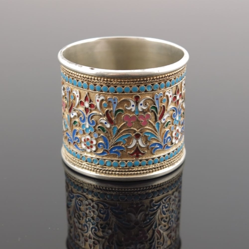 11 - A Russian silver cloisonne enamel napkin ring, scrollwork design within a beaded border, struck stan... 