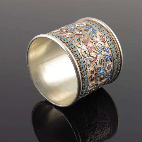 11 - A Russian silver cloisonne enamel napkin ring, scrollwork design within a beaded border, struck stan... 