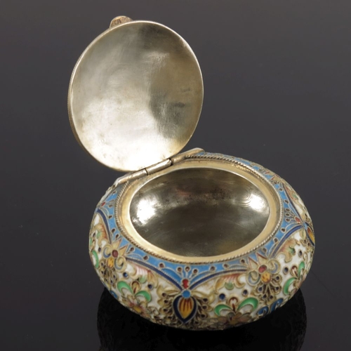 13 - A Russian silver cloisonne enamel snuff box, of circular form, the hinged cover with a floral design... 