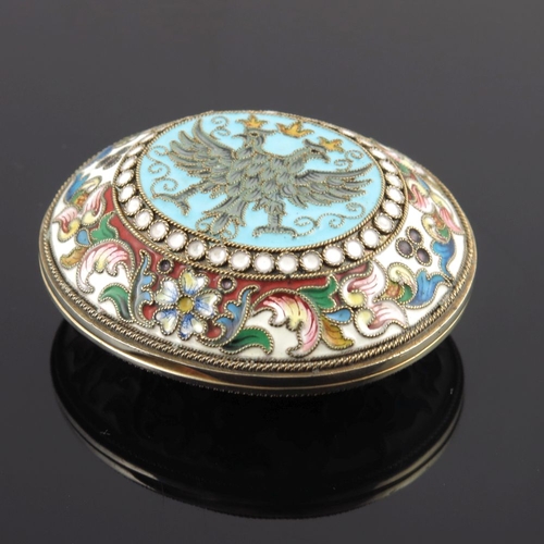 14 - A Russian silver cloisonne enamel snuff box, of oval form with a double headed coronet eagle design ... 