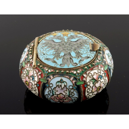 15 - A Russian silver cloisonne enamel snuff box, of circular form, the hinged cover with a double headed... 