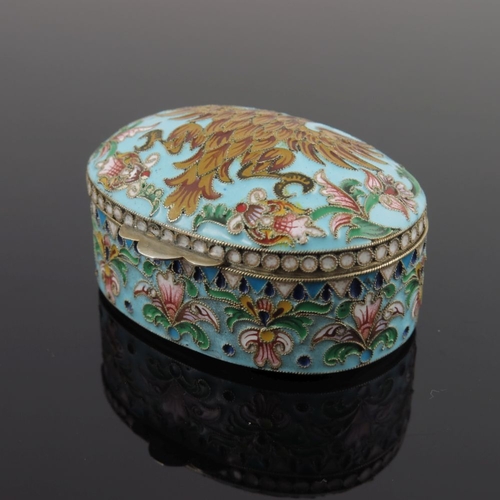 22 - A Russian silver cloisonne enamel pill box, of oval form with double headed eagle to the cover on a ... 