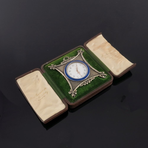 26 - A Russian silver engine turned easel travel timepiece, late 19th Century, white enamel dial with Ara... 