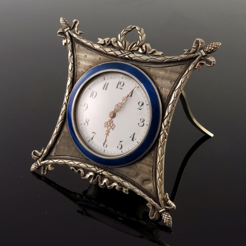 26 - A Russian silver engine turned easel travel timepiece, late 19th Century, white enamel dial with Ara... 