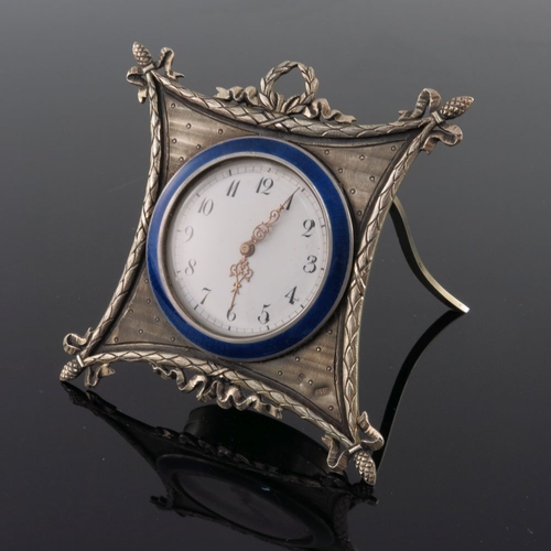 26 - A Russian silver engine turned easel travel timepiece, late 19th Century, white enamel dial with Ara... 