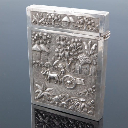 3 - A large Indian white metal card case, 19th century, embossed in relief and chased with agricultural ... 