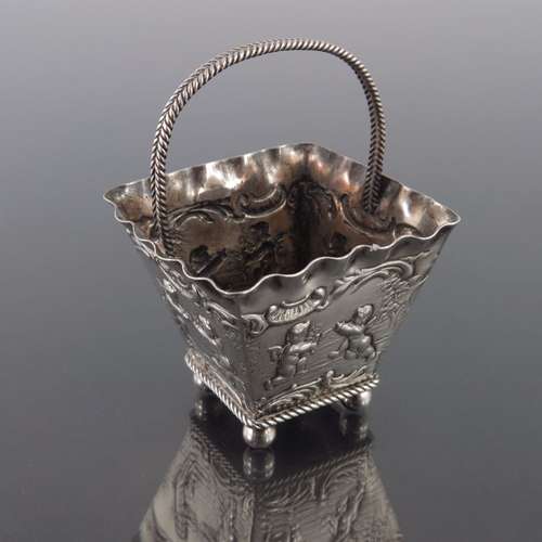 31 - A Dutch silver basket, import marks for London 1896, square section trapezoid form with crimped rims... 